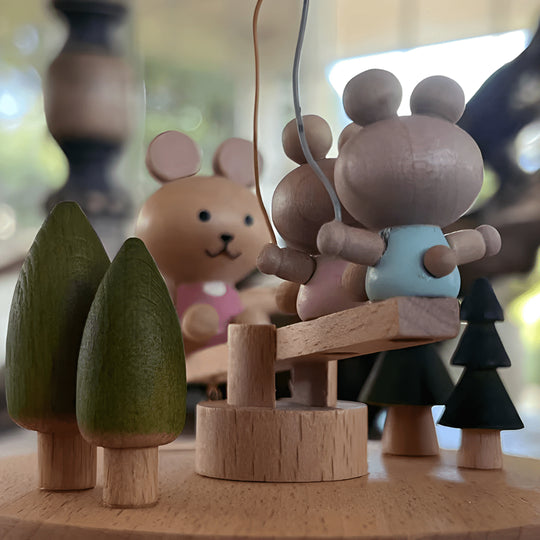 Wooden bunny family music box playing melody with moving seesaw