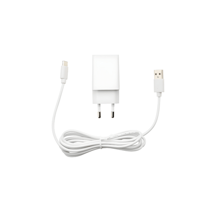 Silvercrest white ultrasonic aroma diffuser on a wooden table with cool mist rising, rechargeable Type-C aromatherapy device.