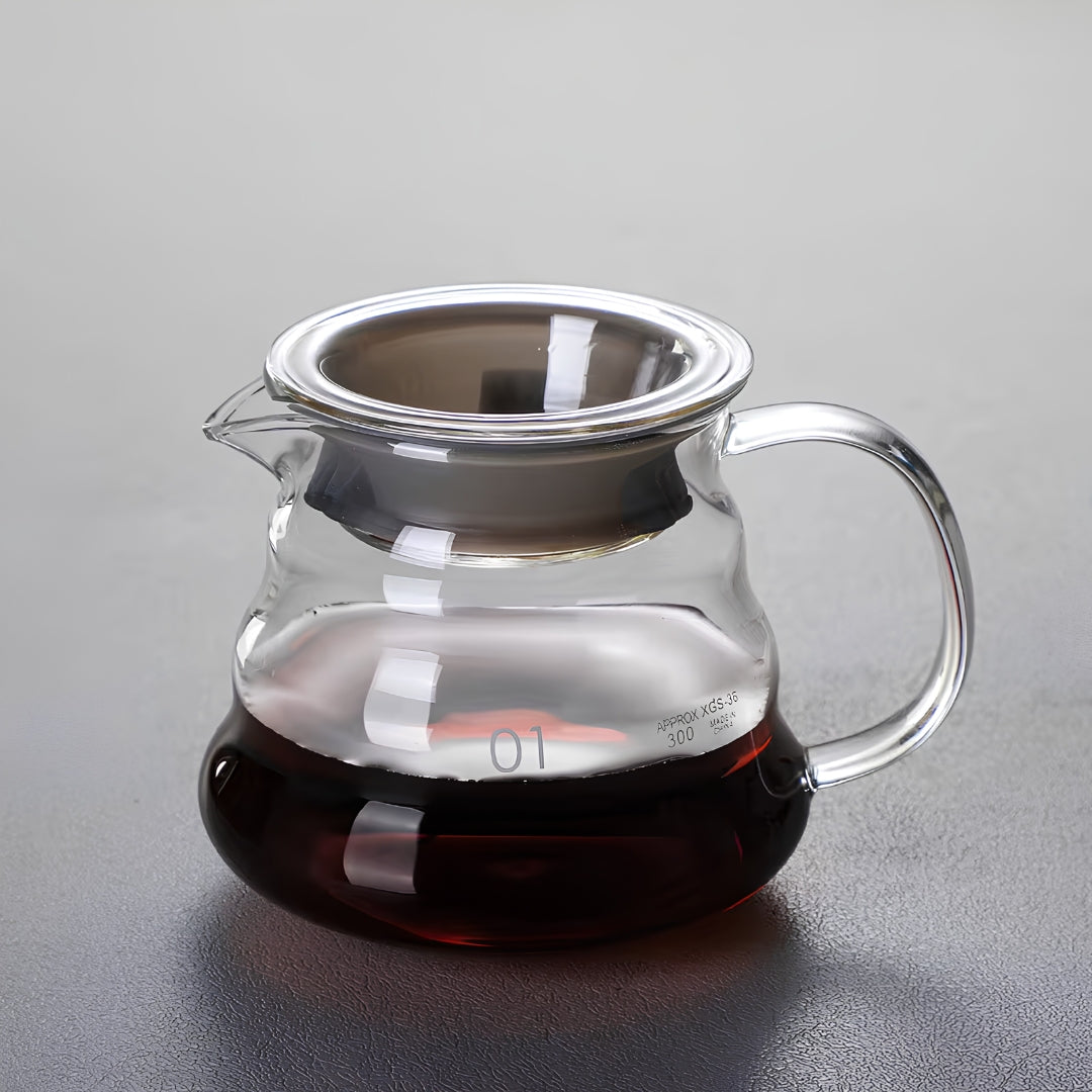 360ml clear glass coffee server with lid, curved handle and pouring spout, partially filled with coffee.
