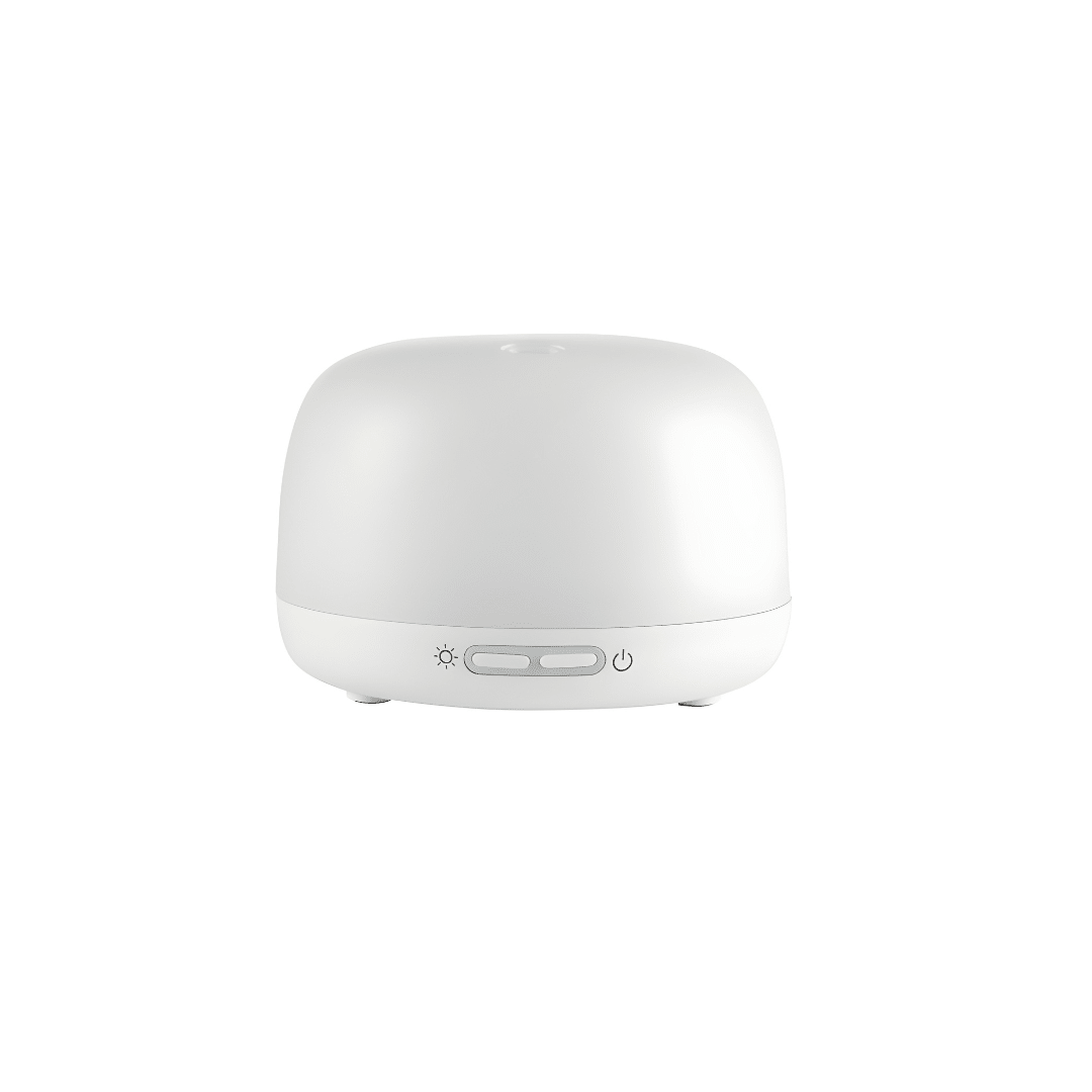 Silvercrest white ultrasonic aroma diffuser on a wooden table with cool mist rising, rechargeable Type-C aromatherapy device.