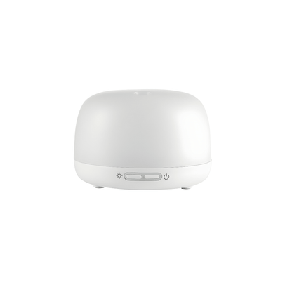 Silvercrest white ultrasonic aroma diffuser on a wooden table with cool mist rising, rechargeable Type-C aromatherapy device.