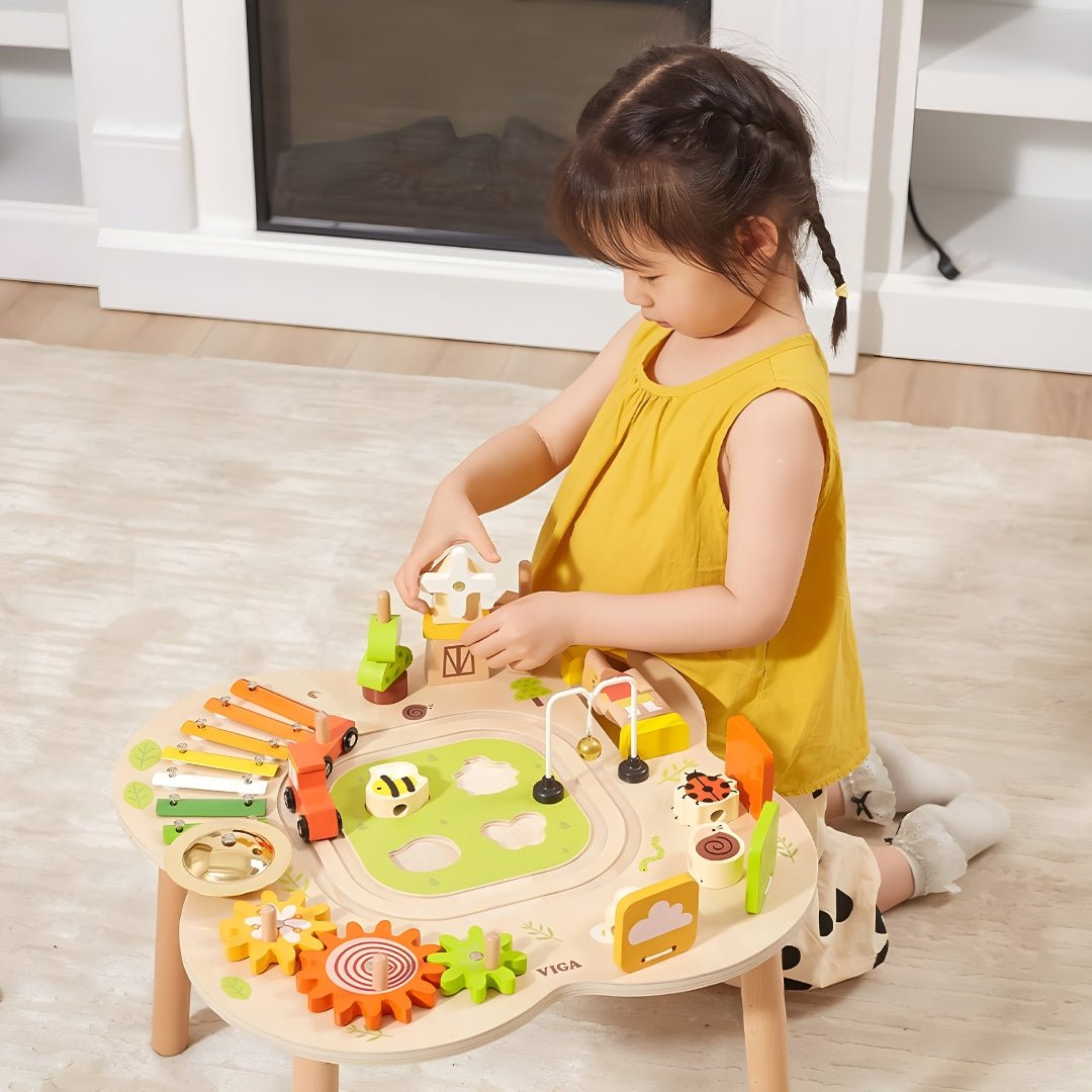 Wooden Montessori sensory activity table with puzzles, gears, bell, and train track — safe non-toxic paint, fun educational toy for toddlers, Beirut Lebanon.