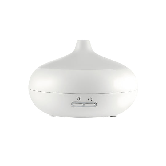 Silvercrest white ultrasonic aroma diffuser on a wooden table with cool mist rising, rechargeable Type-C aromatherapy device.