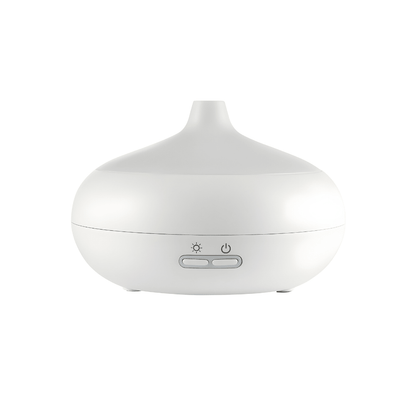 Silvercrest white ultrasonic aroma diffuser on a wooden table with cool mist rising, rechargeable Type-C aromatherapy device.