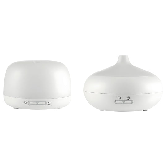 Silvercrest white ultrasonic aroma diffuser on a wooden table with cool mist rising, rechargeable Type-C aromatherapy device.