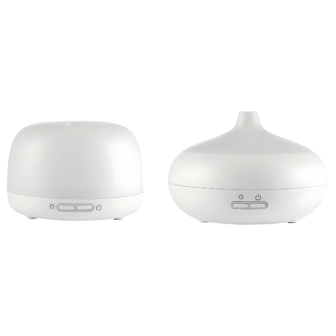 Silvercrest white ultrasonic aroma diffuser on a wooden table with cool mist rising, rechargeable Type-C aromatherapy device.