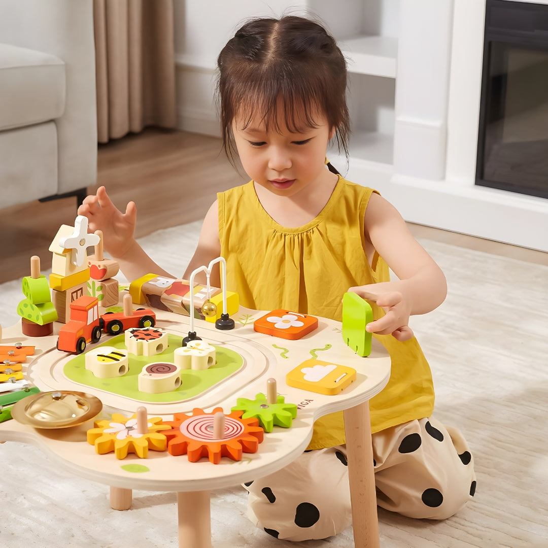 Wooden Montessori sensory activity table with puzzles, gears, bell, and train track — safe non-toxic paint, fun educational toy for toddlers, Beirut Lebanon.