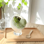 Clear tilted borosilicate glass dessert bowl with stand, 10.5×14cm – ideal for fruit salad, parfaits, and gourmet presentation.

