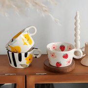 Hand-painted 280ml cartoon ceramic mugs in lemon, strawberry, and floral designs – fun and colorful tableware