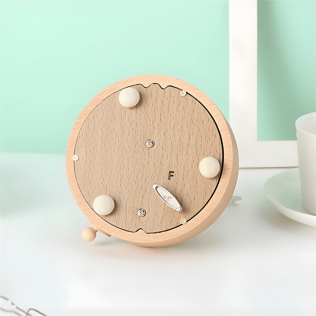 Handcrafted wooden windmill music box with rotating sails and natural wood finish, playing Castle in the Sky melody.