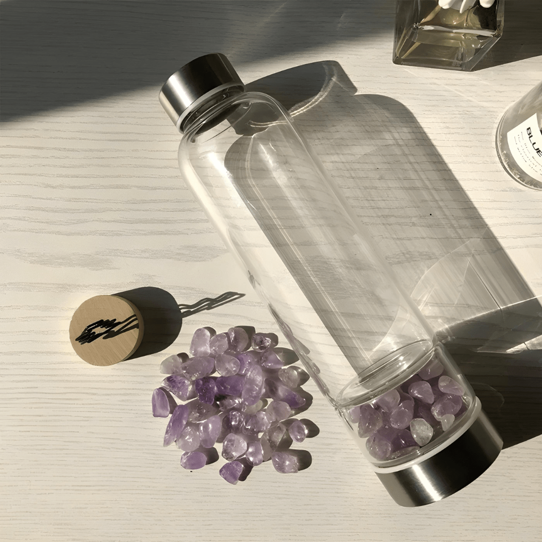 Crystal elixir glass water bottle with stainless steel lid and black protective neoprene case – 550ml