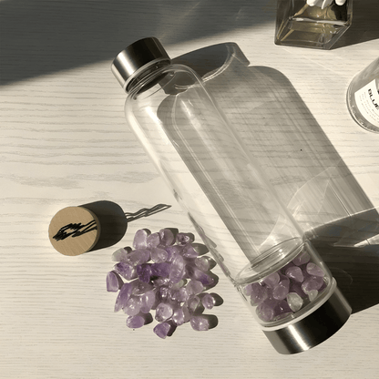 Crystal elixir glass water bottle with stainless steel lid and black protective neoprene case – 550ml