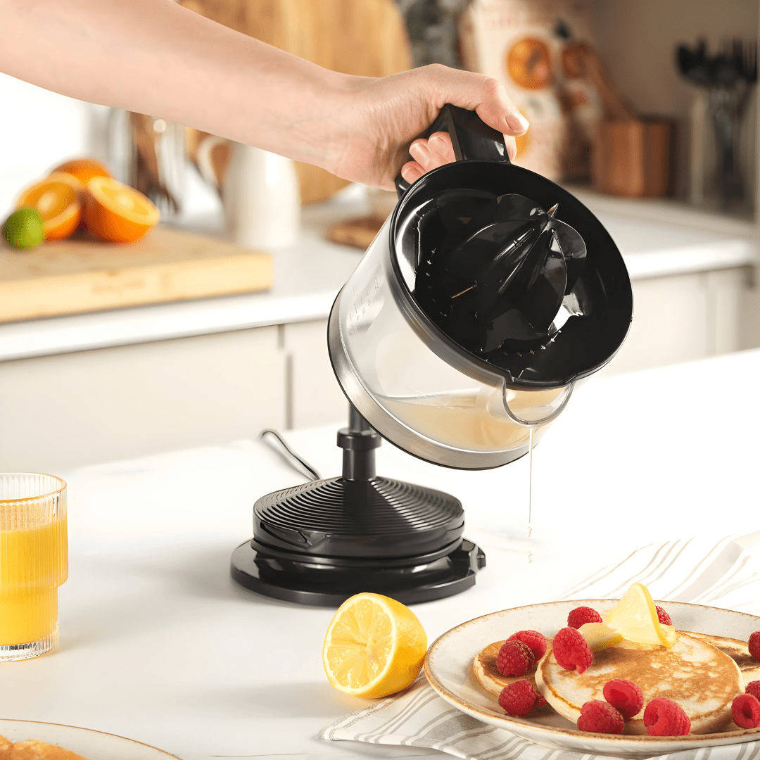 Hoffmans HM-8818 electric citrus juicer in white and clear plastic, 500ml capacity with a compact design for home kitchens.