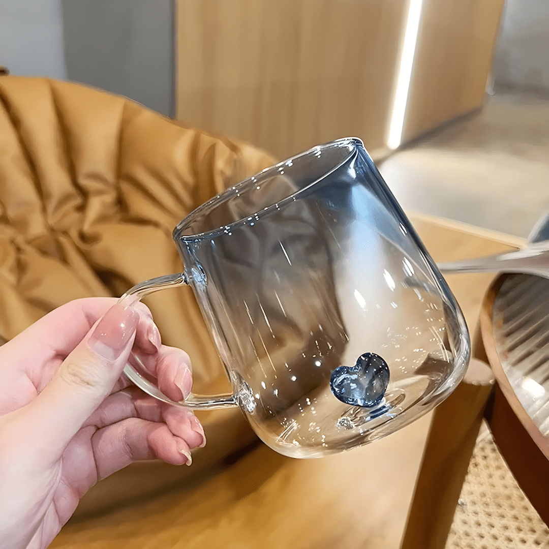 Transparent borosilicate glass cups with pink and blue heart designs, featuring gradient color and elegant handles – 400ml capacity.

