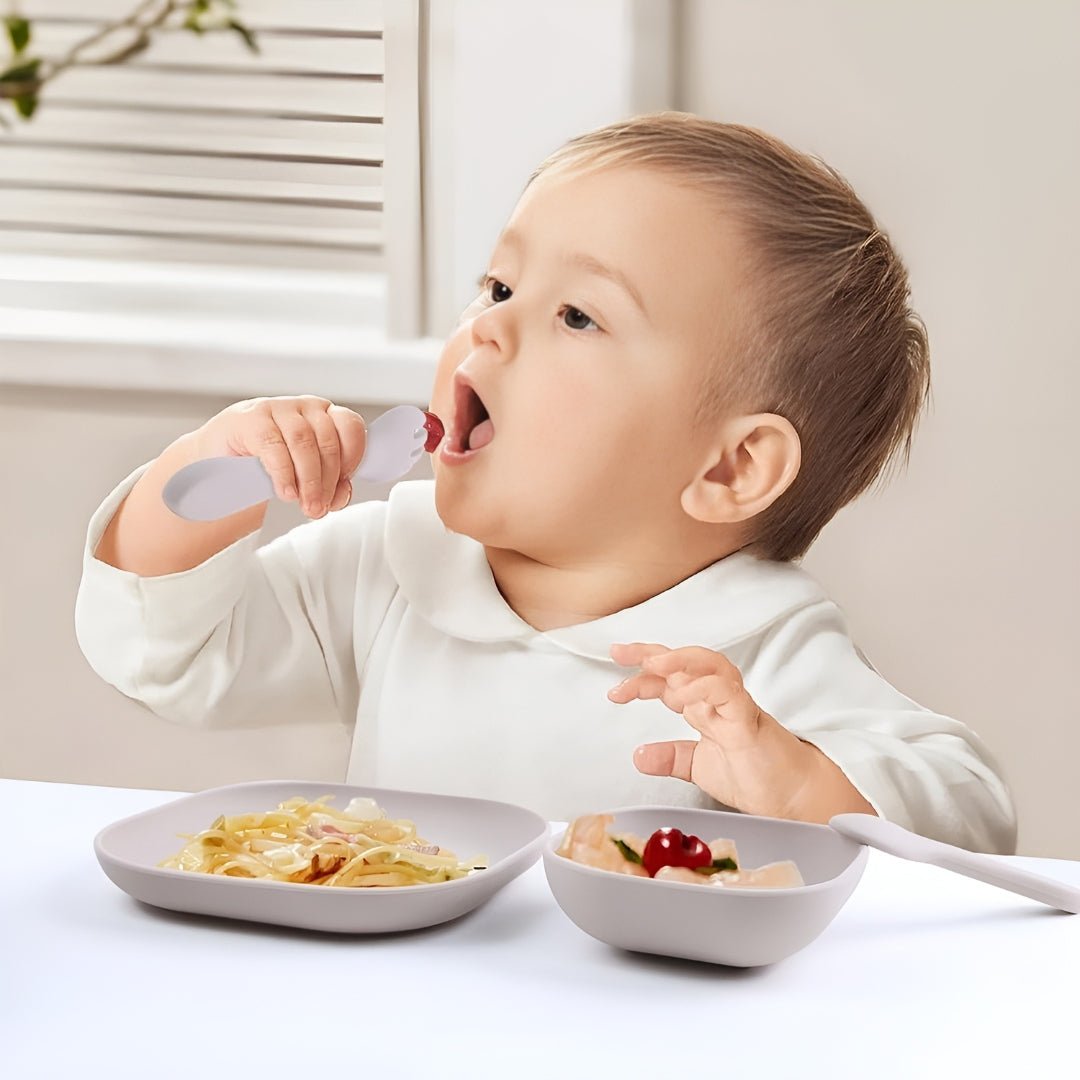 Toddler self-feeding with a baby-safe spoon and plate set, designed by European House Hold for independent and mess-free mealtime