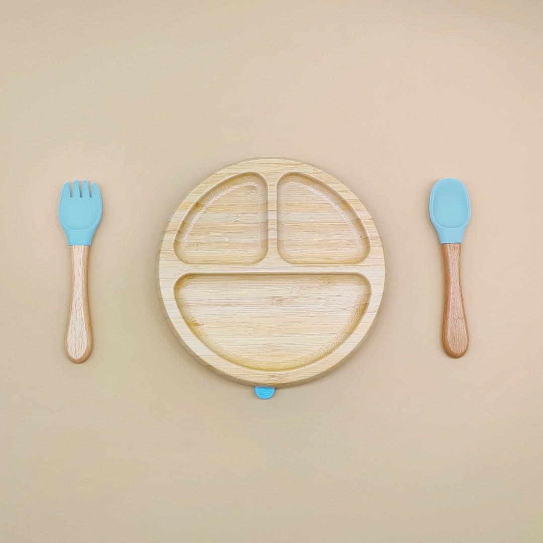 Natural bamboo toddler plate set with blue silicone utensils – divided sections for mealtime