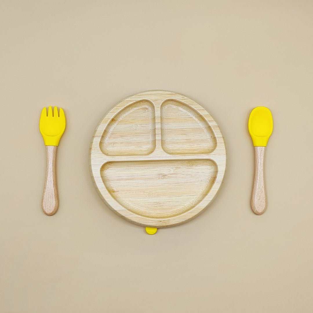 Round bamboo kids plate set with yellow silicone spoon and fork – suction base for toddlers