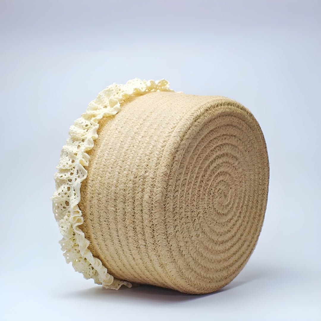 Top-down view of an empty jute storage basket with cream lace detailing around the rim