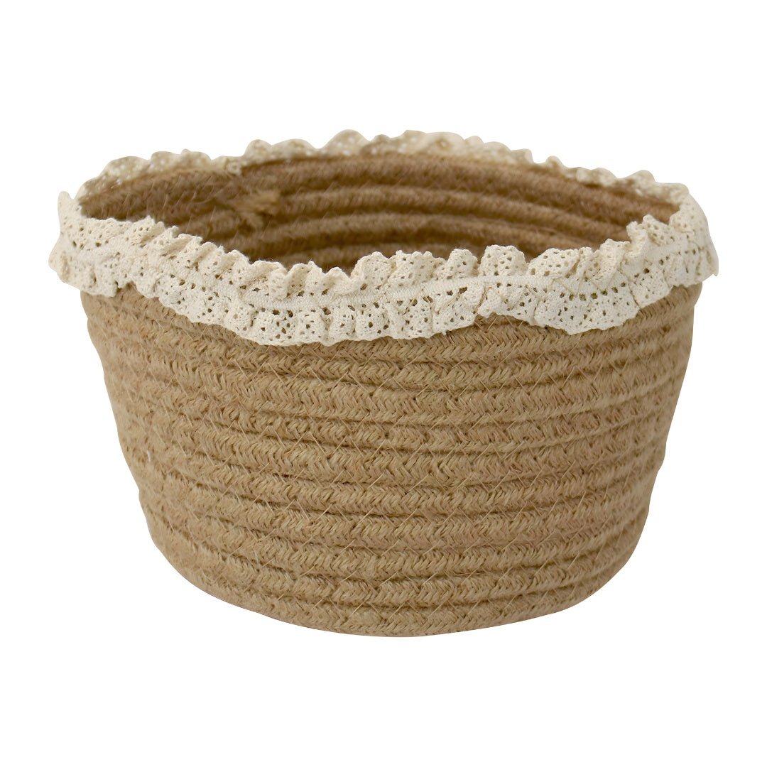 Close-up of the circular woven pattern on the bottom of a natural jute storage basket