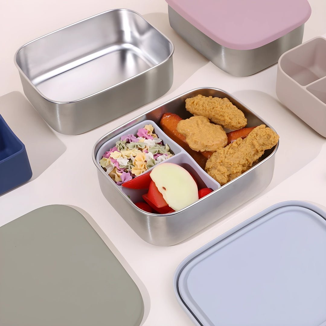 Colorful stainless steel lunchboxes with silicone dividers, filled with a variety of meals — premium lunchware by European House Hold