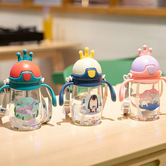 Cute 350ml BPA-free kids sipper water bottle with crown-shaped lid and animal prints – available in Elephant, Dolphin, and Penguin designs
